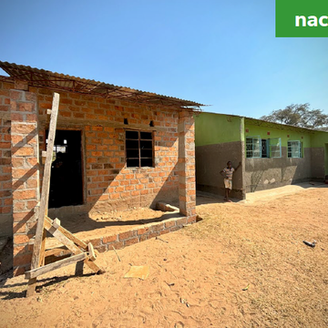 A renovated building with new walls and windows, surrounded by a clean environment. Labeled 'after'.