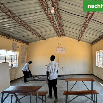 A renovated classroom with new benches and a clean, painted interior. Labeled 'after'.